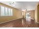 Living room with wood floors, sliding glass doors, and pool view at 2331 W Kristina Ave, San Tan Valley, AZ 85144