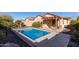 Inviting backyard with a sparkling pool and relaxing patio at 2331 W Kristina Ave, San Tan Valley, AZ 85144