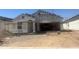 House under construction with scaffolding and dirt at 24158 W Hidalgo Ave, Buckeye, AZ 85326