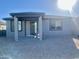 House exterior with covered patio and desert landscaping at 24550 W Mohave St, Buckeye, AZ 85326