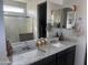 Modern bathroom with dual sinks and granite countertops at 24550 W Mohave St, Buckeye, AZ 85326