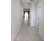 Bright hallway with tile flooring leading to living areas at 24550 W Mohave St, Buckeye, AZ 85326