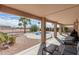 Back patio offering view of uniquely shaped pool, desert landscaping and privacy wall at 2551 E Saratoga St, Gilbert, AZ 85296