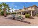 Large home's backyard with desert landscape, pool, patio, balcony, and outdoor seating area at 2551 E Saratoga St, Gilbert, AZ 85296