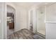 Open bathroom layout featuring wood look floors and a view from the shower to the bedroom at 2551 E Saratoga St, Gilbert, AZ 85296