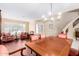 Elegant dining room with a wooden table, chairs, and hardwood floors at 2551 E Saratoga St, Gilbert, AZ 85296