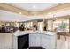 Open kitchen layout with island seating, connecting seamlessly to the living and dining areas at 2551 E Saratoga St, Gilbert, AZ 85296