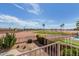 Balcony view overlooking a scenic golf course with palm trees under a clear blue sky at 2551 E Saratoga St, Gilbert, AZ 85296