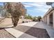 Backyard with gravel, walkway, and trees at 2605 N 133Rd Ave, Goodyear, AZ 85395