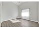 Bright bedroom with wood-look floors and neutral walls at 2605 N 133Rd Ave, Goodyear, AZ 85395