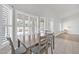 Dining area with wood table and chairs, and window with plantation shutters at 2605 N 133Rd Ave, Goodyear, AZ 85395