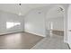 Open dining area with hardwood floors and vaulted ceiling at 2605 N 133Rd Ave, Goodyear, AZ 85395