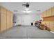 Two-car garage with built-in cabinets and storage at 2605 N 133Rd Ave, Goodyear, AZ 85395