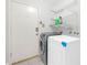 Convenient laundry room with washer, dryer, and shelving at 2605 N 133Rd Ave, Goodyear, AZ 85395