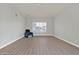 Bright living room with vinyl flooring and large window at 2605 N 133Rd Ave, Goodyear, AZ 85395