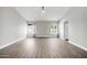 Large living room with wood-look floors and neutral walls at 2605 N 133Rd Ave, Goodyear, AZ 85395