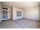 Covered patio with cement flooring, security door, window, and ceiling fan at 2605 N 133Rd Ave, Goodyear, AZ 85395