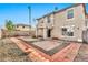 Spacious backyard with a covered patio, hardscape, and ample space for outdoor activities at 2626 S Southwind Dr, Gilbert, AZ 85295