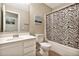 Bathroom featuring a single sink vanity and tub/shower with a patterned curtain at 2626 S Southwind Dr, Gilbert, AZ 85295