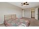 Bedroom featuring a light wooden bed frame and neutral carpet at 2626 S Southwind Dr, Gilbert, AZ 85295