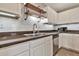 Close-up of the kitchen sink, subway tile backsplash, and stainless steel appliances at 2626 S Southwind Dr, Gilbert, AZ 85295