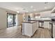 Bright kitchen with stainless steel appliances, island, and lots of cabinet storage at 2626 S Southwind Dr, Gilbert, AZ 85295