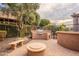 Backyard with a built-in grill and fire pit at 28837 N 127Th Ave, Peoria, AZ 85383