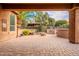 Landscaped backyard with fire pit and built-in grill at 28837 N 127Th Ave, Peoria, AZ 85383