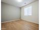 Simple bedroom with light walls and wood flooring at 28837 N 127Th Ave, Peoria, AZ 85383