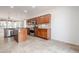 Spacious kitchen with granite countertops and wood cabinets at 28837 N 127Th Ave, Peoria, AZ 85383