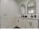 Bathroom with dual sinks and white cabinets at 3530 W Marlette Ave, Phoenix, AZ 85019