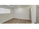 Simple bedroom with wood-look floors and a closet with sliding doors at 3530 W Marlette Ave, Phoenix, AZ 85019