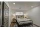 Bright bedroom with a metal bed frame and wood-look flooring at 3530 W Marlette Ave, Phoenix, AZ 85019