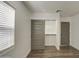 Bedroom closet with double doors and built-in shelving at 3530 W Marlette Ave, Phoenix, AZ 85019