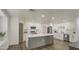 Bright kitchen with an island, white cabinets, and stainless steel appliances at 3530 W Marlette Ave, Phoenix, AZ 85019