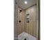 Walk-in shower with wood-look tile and hexagon floor at 3530 W Marlette Ave, Phoenix, AZ 85019