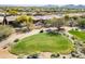 Aerial view of houses and a golf course at 41604 N Cedar Chase Rd, Anthem, AZ 85086