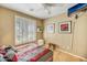 Bright bedroom with window shutters, a bed, and wood floors at 41604 N Cedar Chase Rd, Anthem, AZ 85086