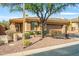 Single-story home with desert landscaping, two-car garage, and neutral exterior at 41604 N Cedar Chase Rd, Anthem, AZ 85086