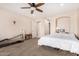 Bedroom with ceiling fan, carpeted floor, and home gym area at 44429 N 1St Dr, New River, AZ 85087