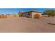 Casita with attached garage, gravel driveway, and desert landscaping at 44429 N 1St Dr, New River, AZ 85087