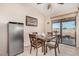 Bright dining area with sliding door access to backyard at 44429 N 1St Dr, New River, AZ 85087