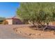 Landscaped front yard with gravel and mature trees at 44429 N 1St Dr, New River, AZ 85087