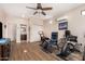 Bright home gym with exercise equipment and access to bathroom at 44429 N 1St Dr, New River, AZ 85087