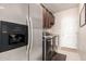 Laundry room with stainless steel appliances and built-in cabinets at 44429 N 1St Dr, New River, AZ 85087