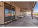 Covered patio with sliding glass doors and outdoor table at 44429 N 1St Dr, New River, AZ 85087