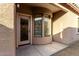 Back porch area with door and curved windows at 4511 W Valencia Dr, Laveen, AZ 85339