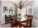 This dining room is a square shape with a wooden table and chairs at 4511 W Valencia Dr, Laveen, AZ 85339