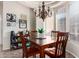 Well-lit dining area shows a chandelier and large bay window at 4511 W Valencia Dr, Laveen, AZ 85339