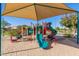 Residents have access to a fun playground with a large sunshade to keep everyone cool at 4511 W Valencia Dr, Laveen, AZ 85339